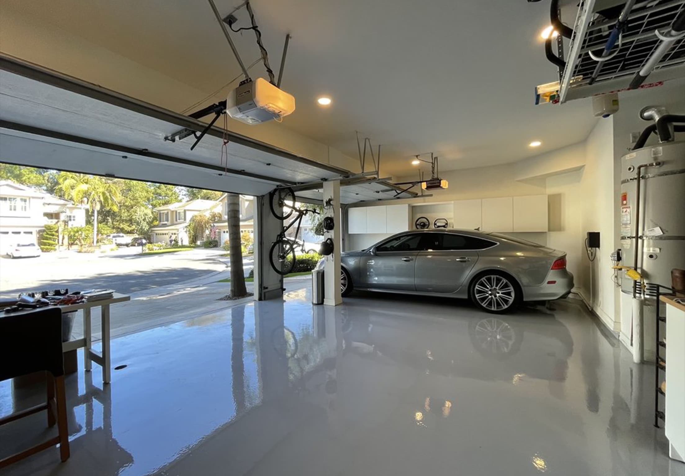 Epoxy coated garage floor with car — Florida residential