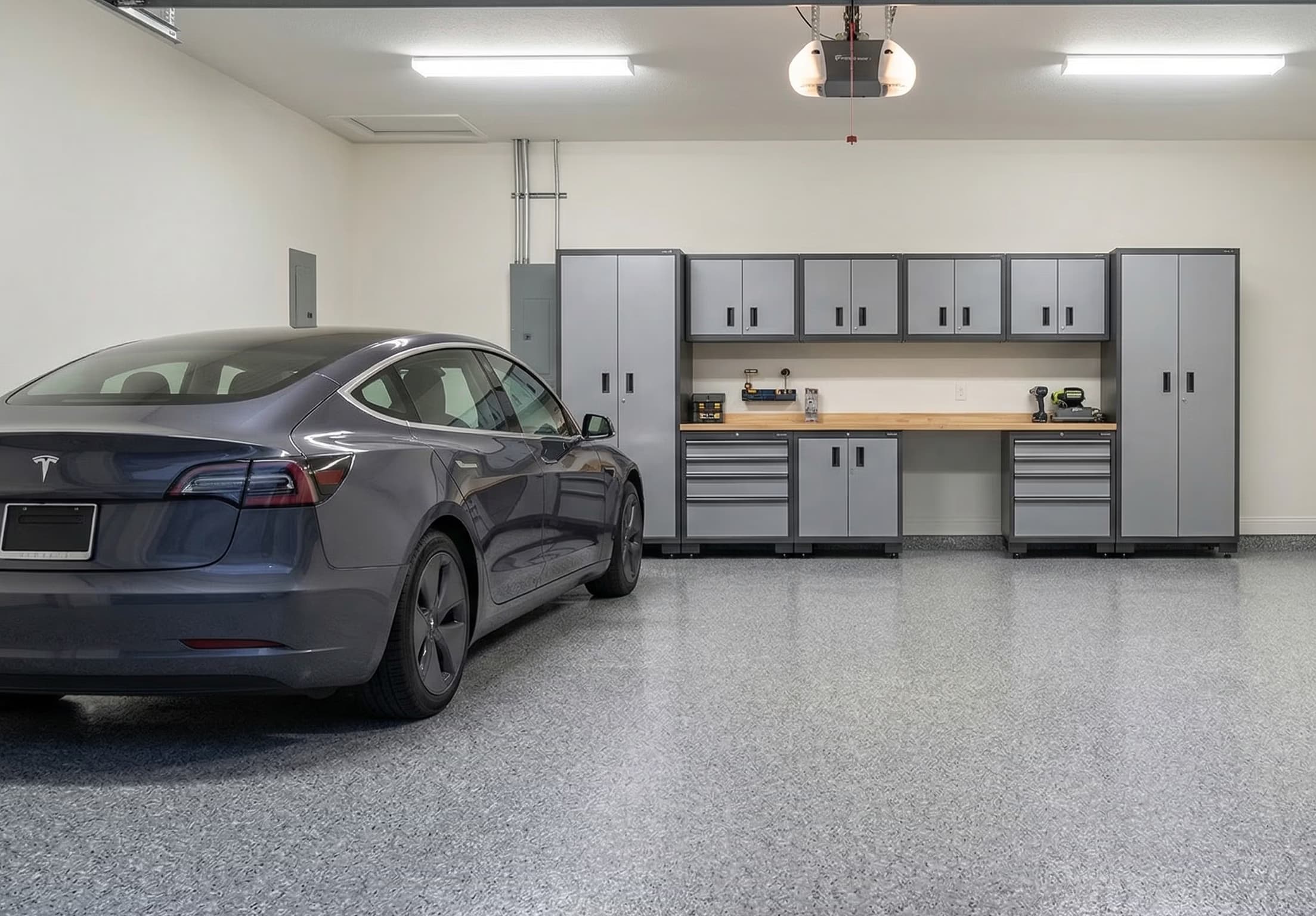 Epoxy garage floor coating with Tesla — chip system finish, Florida